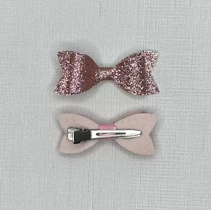 2 faux leather bows