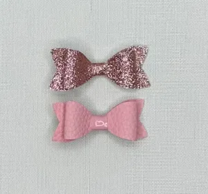 2 faux leather bows